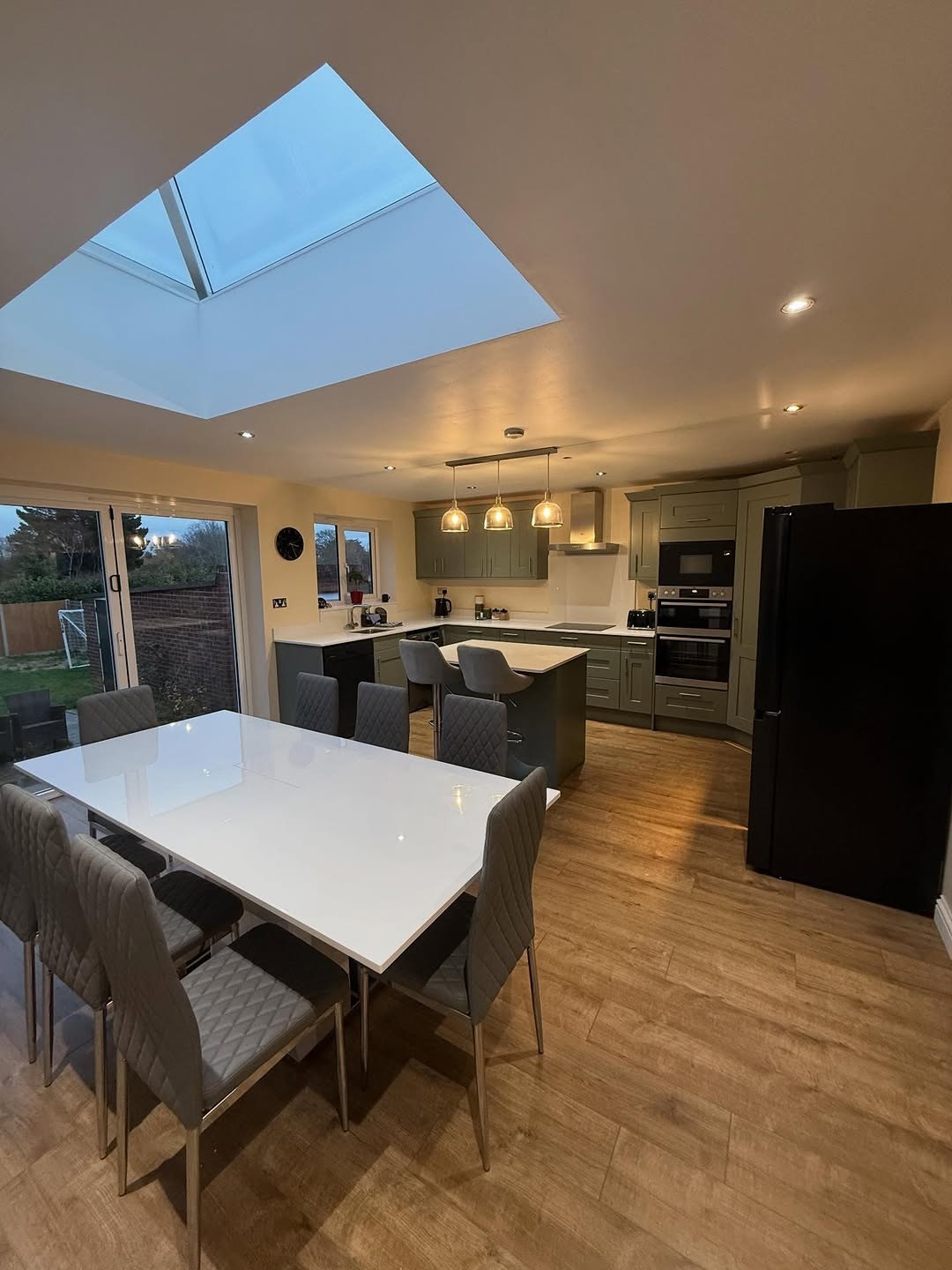 Kitchen installation with oak floor and island