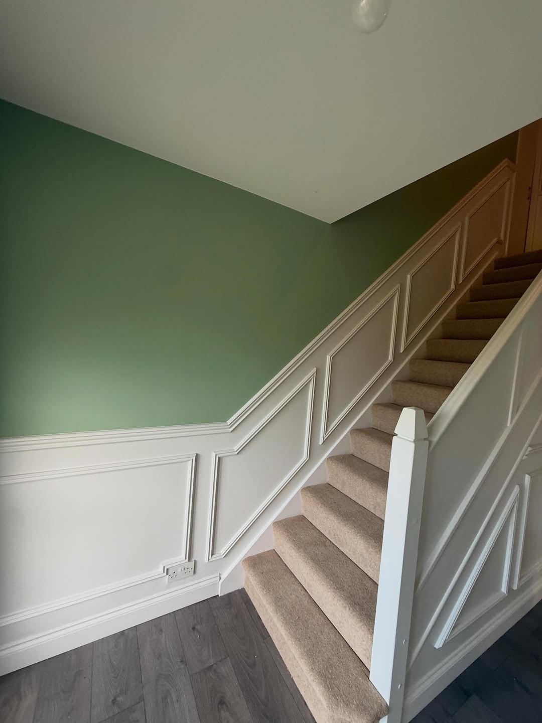 Hallway and landing panelling beside stairs