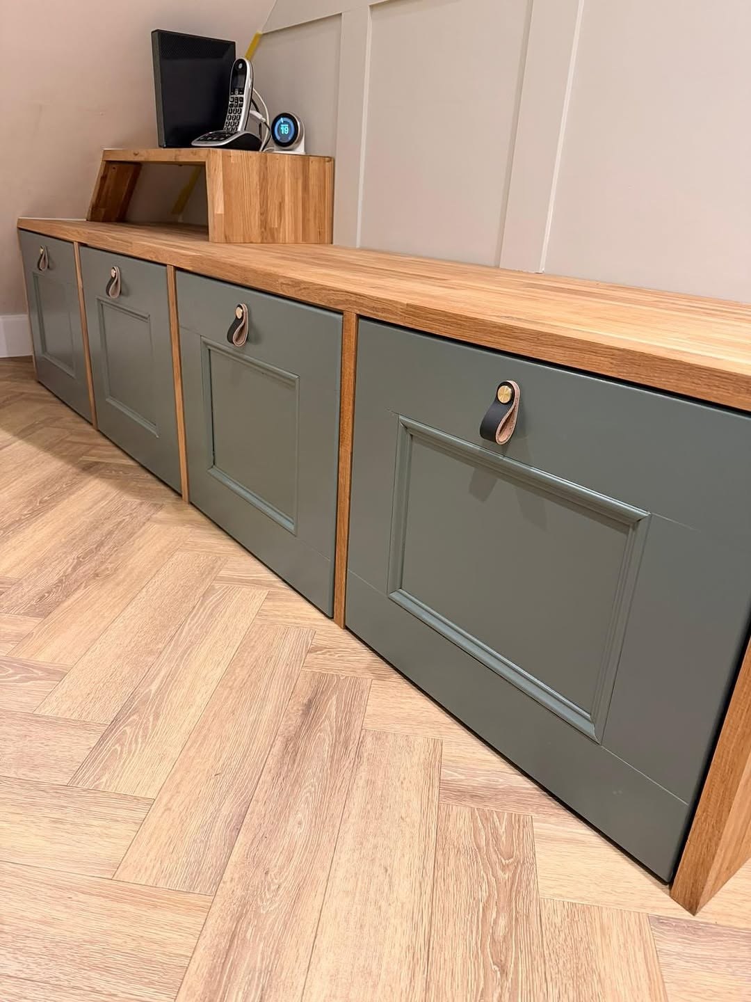 Bespoke storage drawers with oak worktop and leather pulls